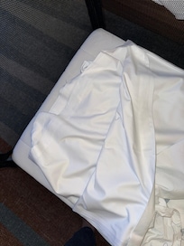 Double sheet folded in cot