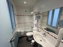 Bathroom was clean and functional. The shower/bath had a high edge which made it tricky to get in and out.