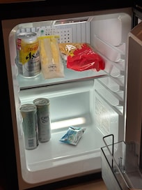 Nice in-room bar fridge with 2 complimentary drinks and chocolate.