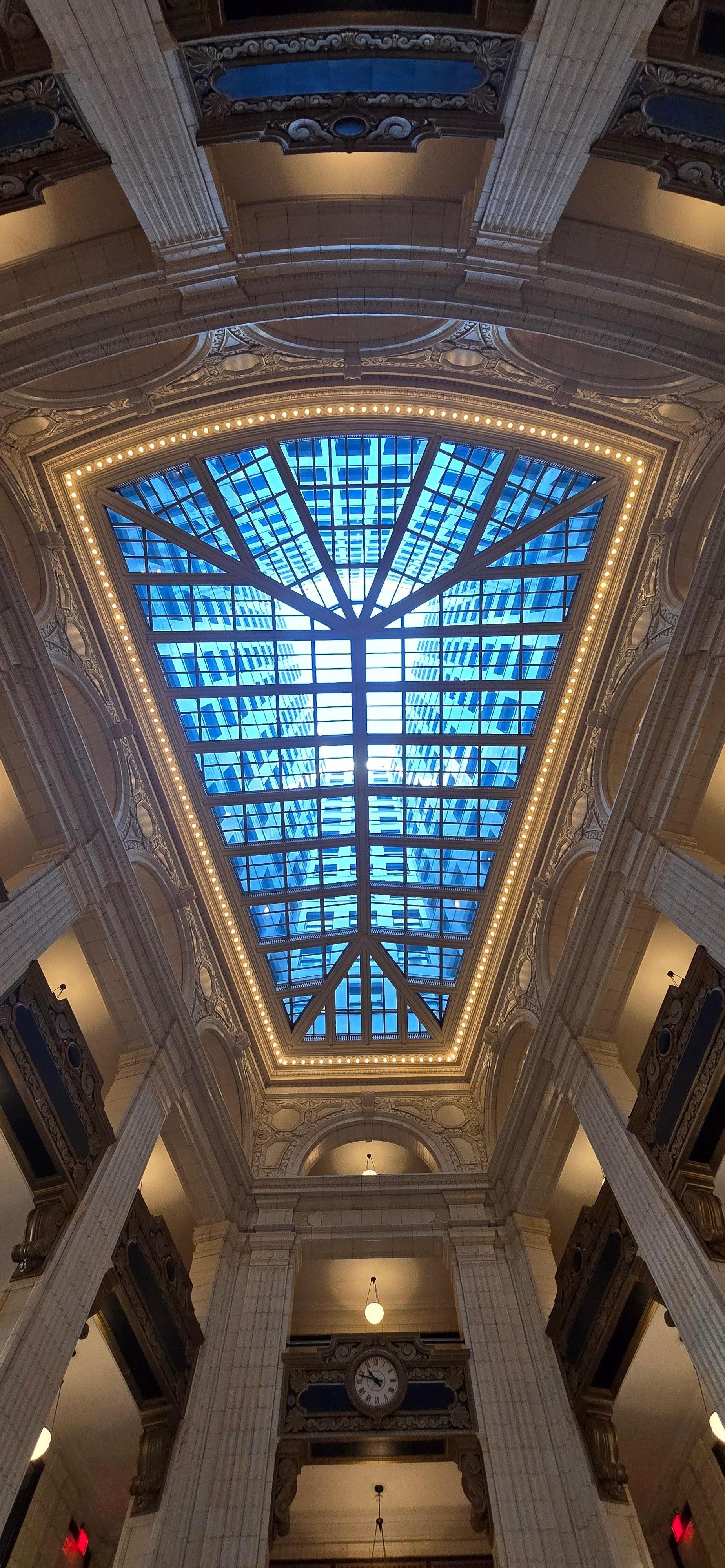 Sitting in the lobby, drinking  my coffee,  looking up.