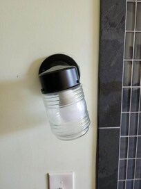 Perfectly leveled outdoor light fixture as the bedside "lamp"