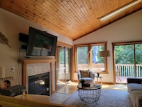Living room with back deck in the background.
