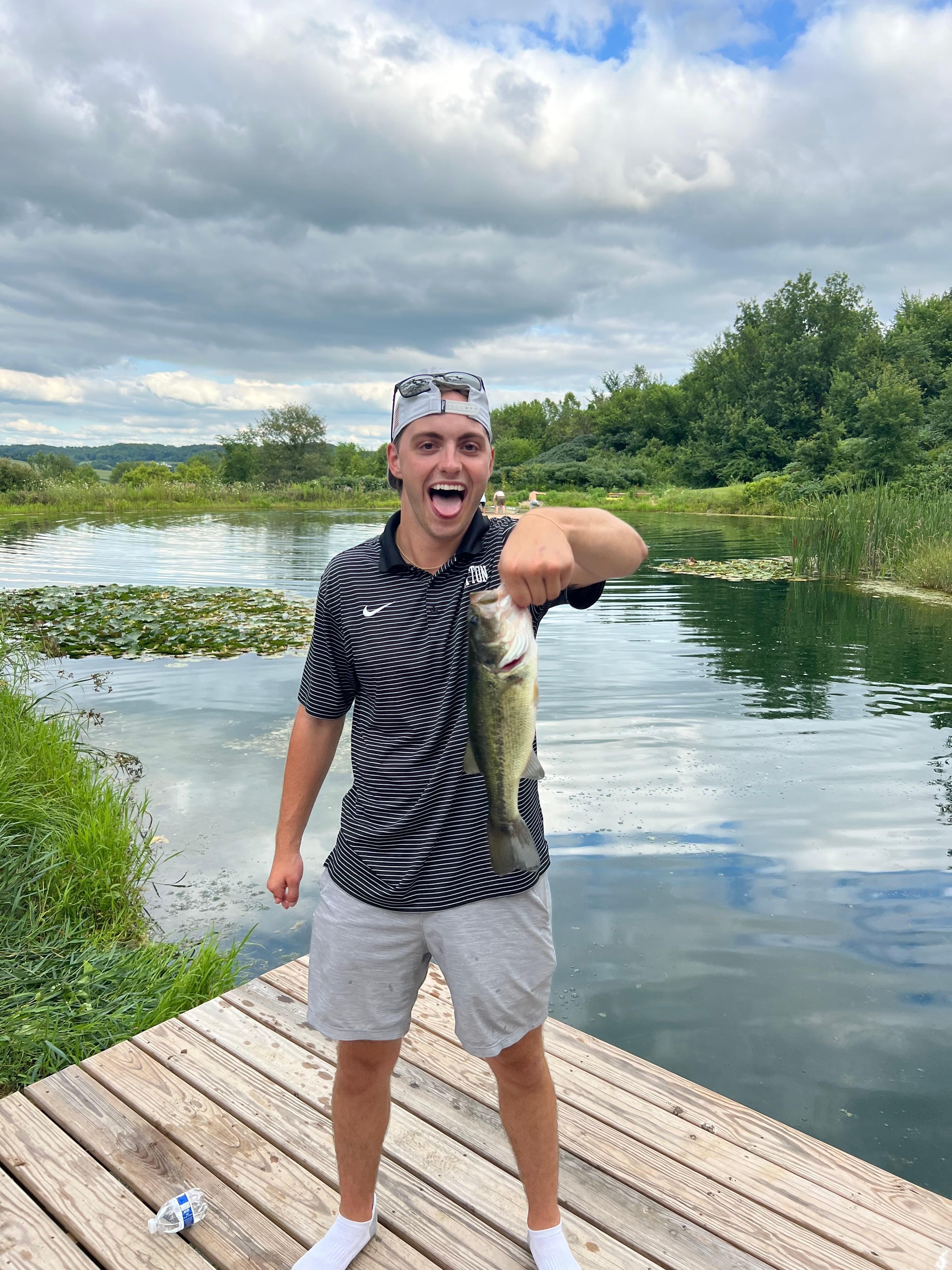 One of the first few casts on the pond my son landed a nice bass.  