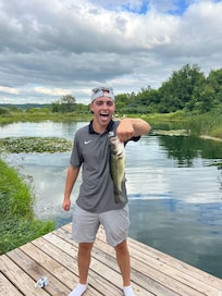One of the first few casts on the pond my son landed a nice bass.