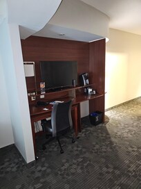Across from couch with bigger Tv