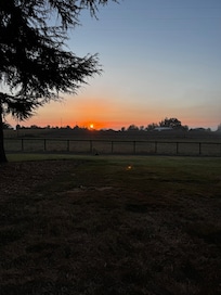 Sunrise from the Adirondack chairs just outside.