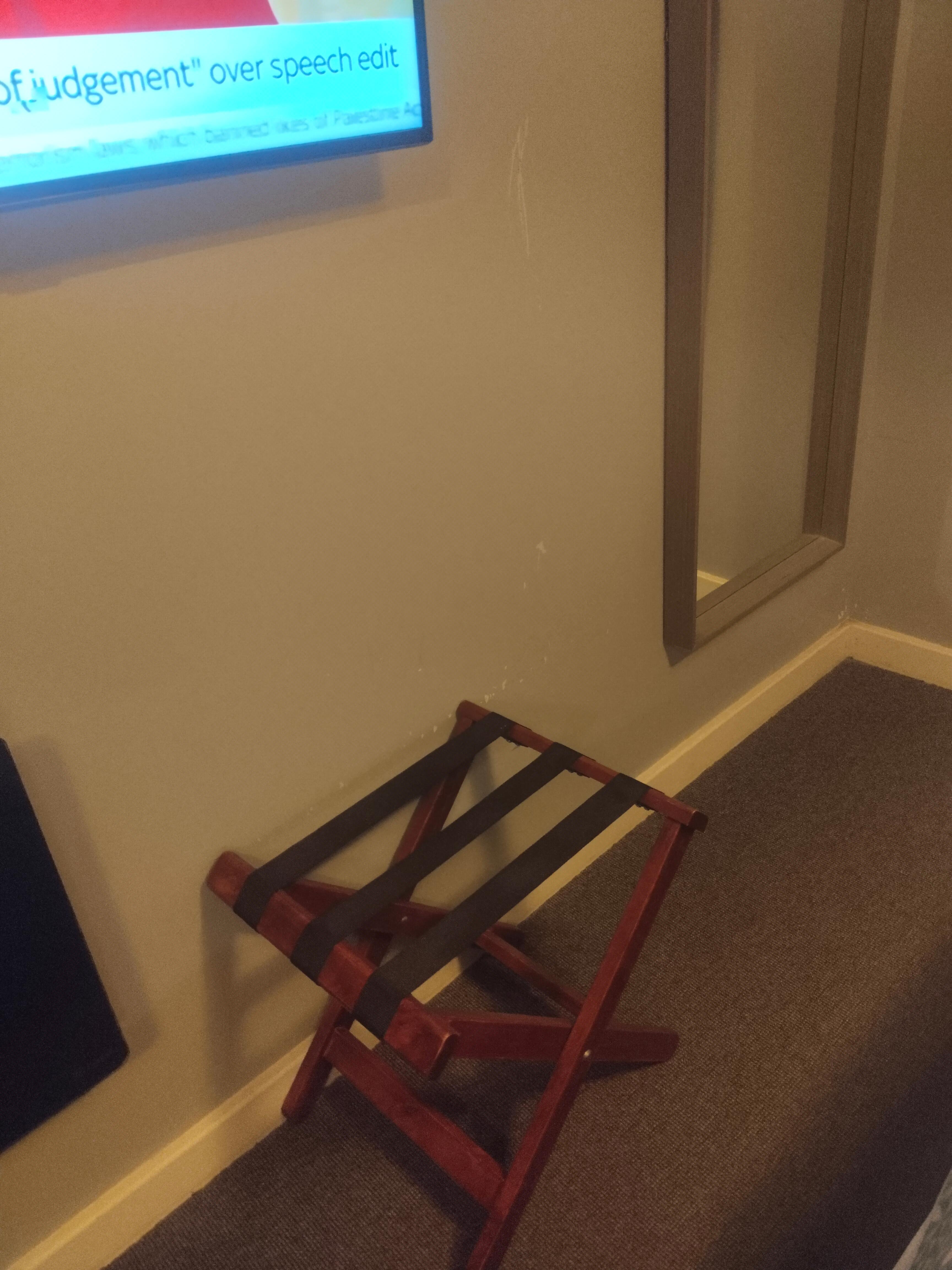 The luggage holder was dusty