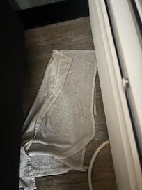 Towel soaking up water from AC