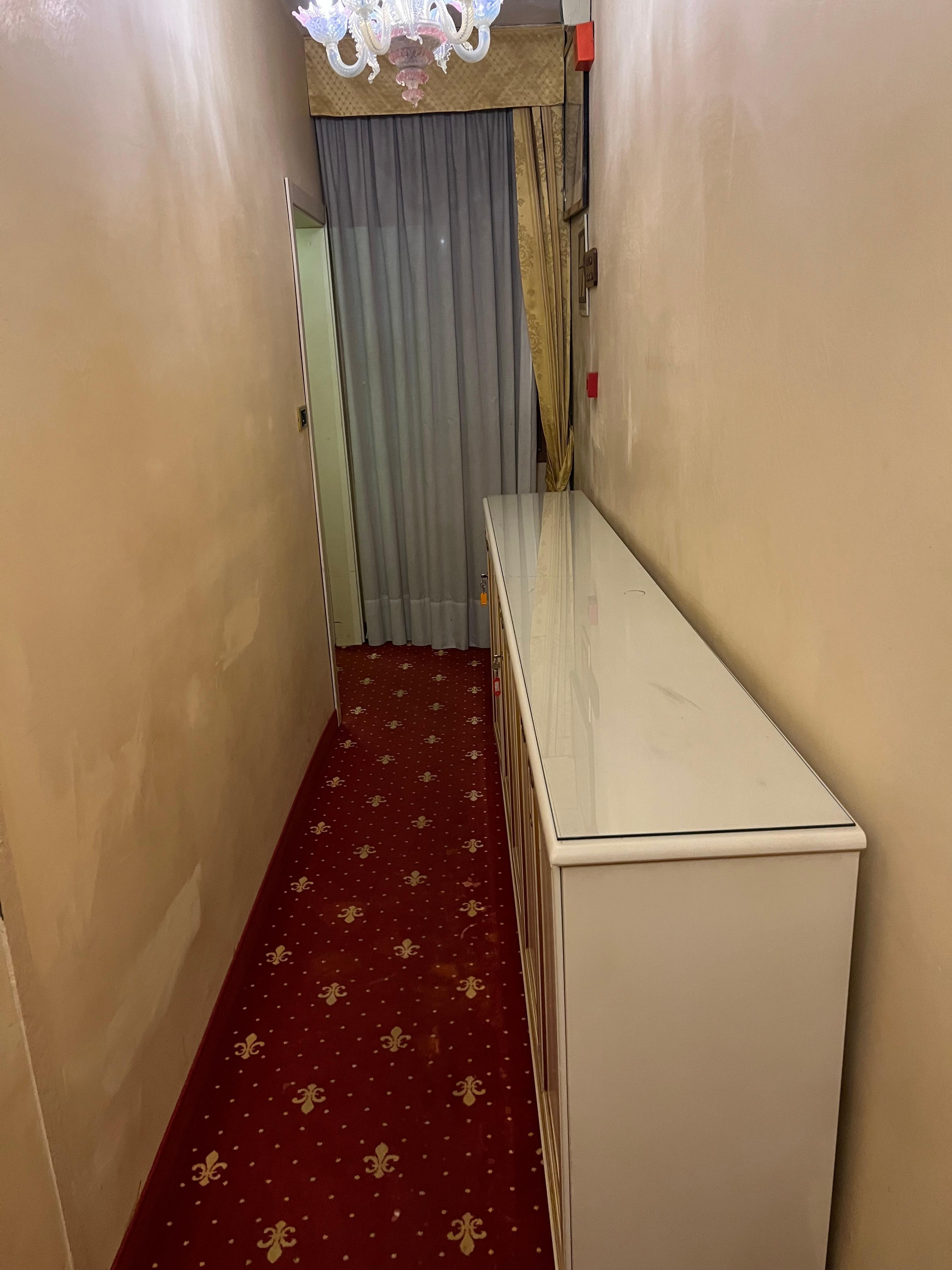 Extremely narrow hallway. Can this even be legal as a fire escape route?