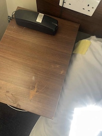 The scuffs on one bed side table