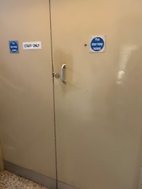 Padlocked fire door that was for staff only.