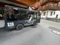 Electric shuttle that picks you up and drops you off at the train station.