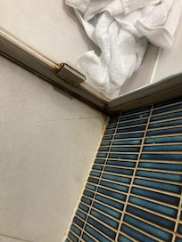 The shower is not cleaned. The dirt and scrum has piled up and was coming away if the water hit it. The dirt was so built up