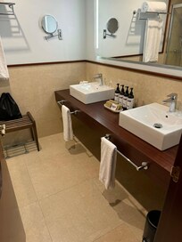 The bathroom felt spacious and luxurious, with an excellent shower. It took us a moment to work out the European tap, but once sorted it was a pleasure, and the little emergency tubes of toothpaste were a lovely touch.