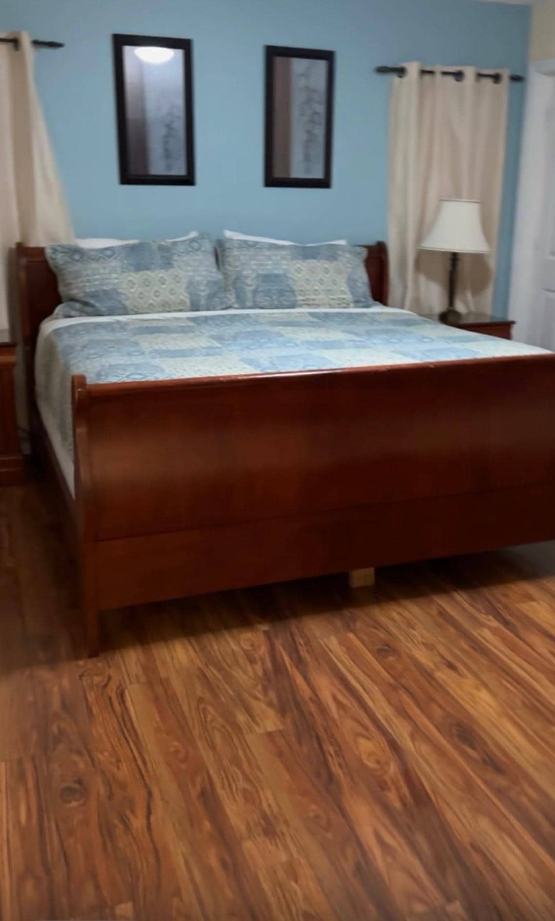 Master bedroom with large closet, dresser, end tables and a private bathroom 