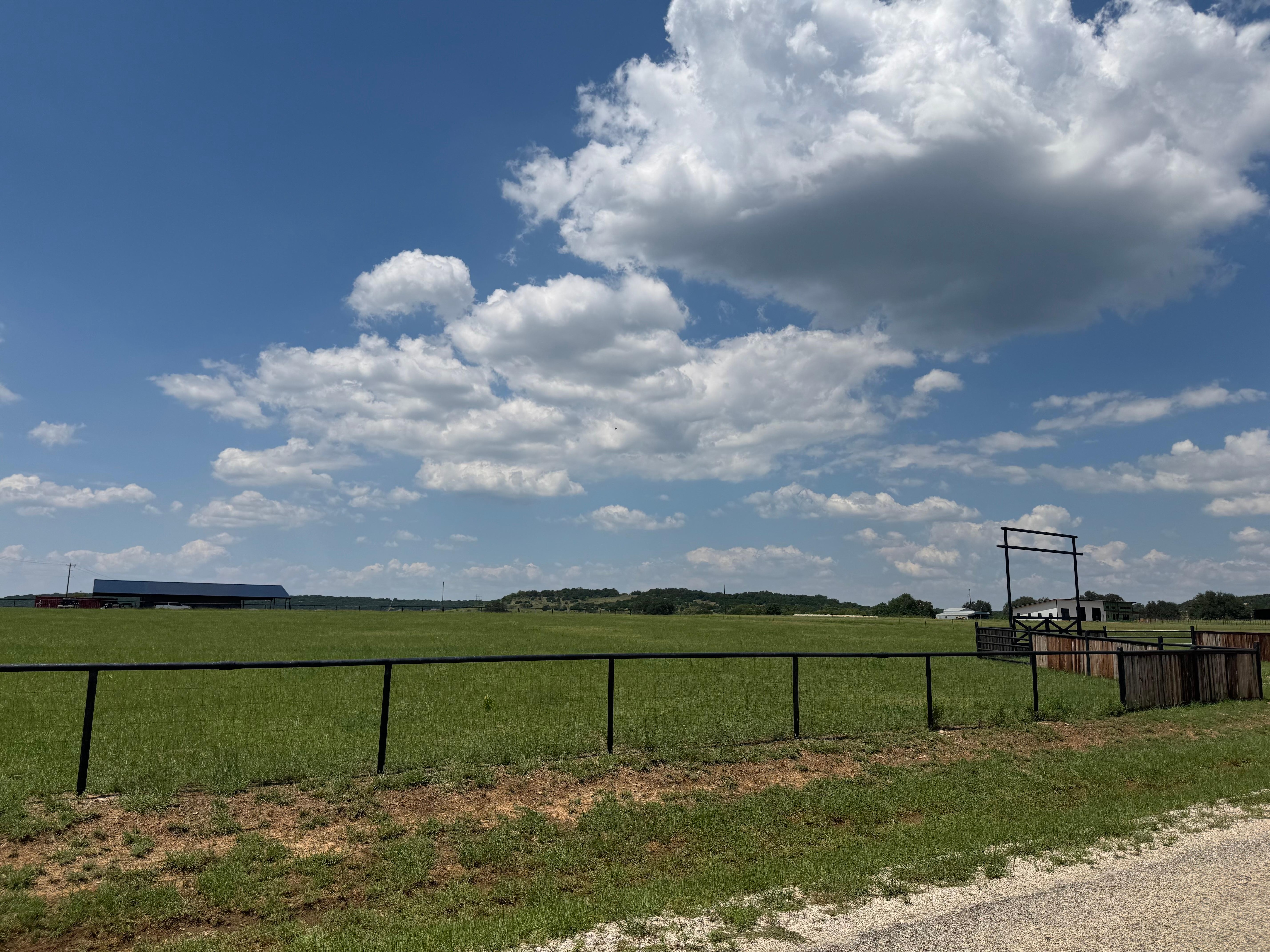 The road coming into the neighborhood. 