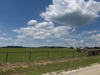 The road coming into the neighborhood.