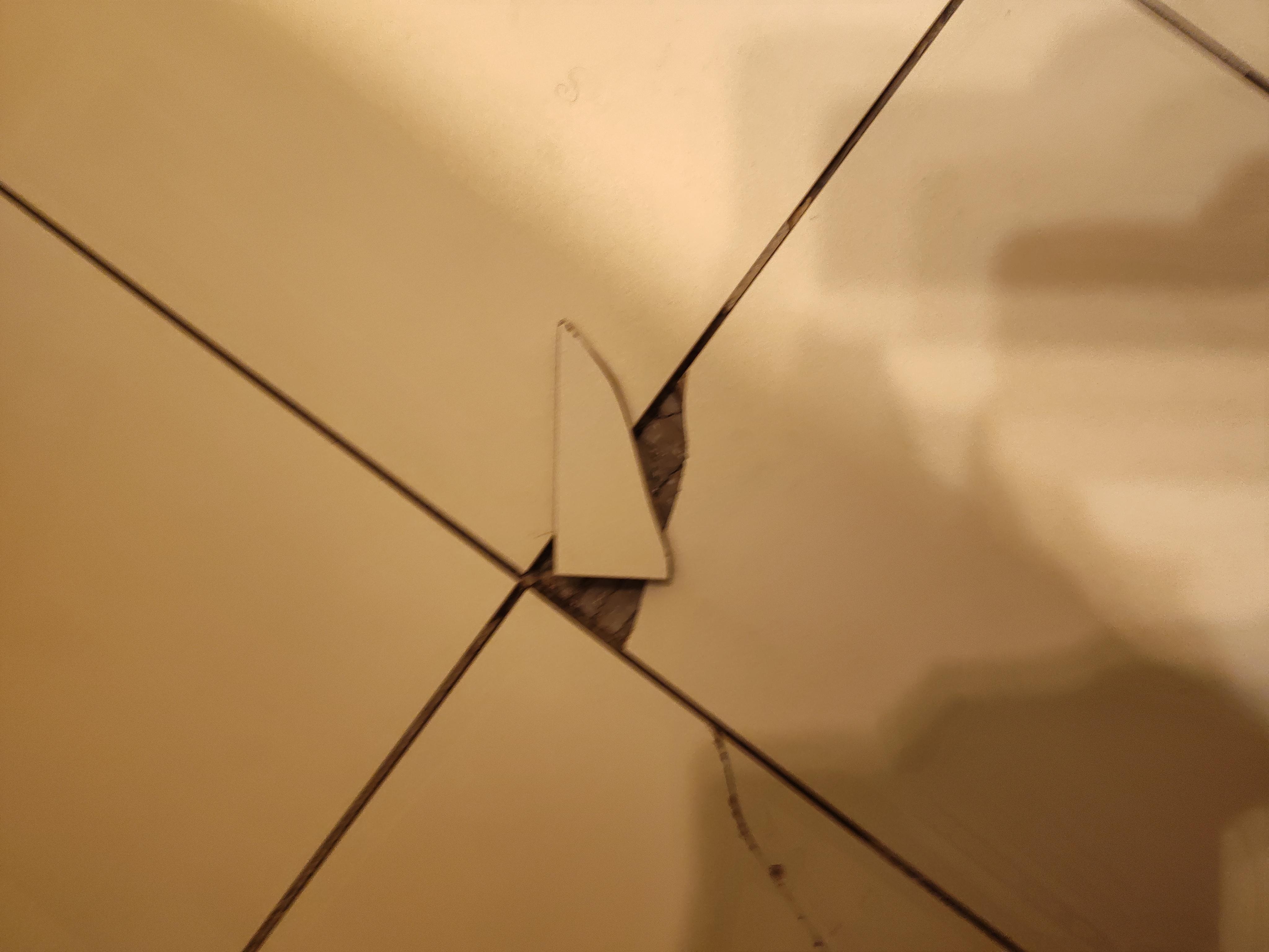 Broken tiles in bathroom