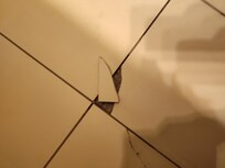 Broken tiles in bathroom
