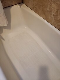 Tub with visible grime and filth. Was not cleaned for us.