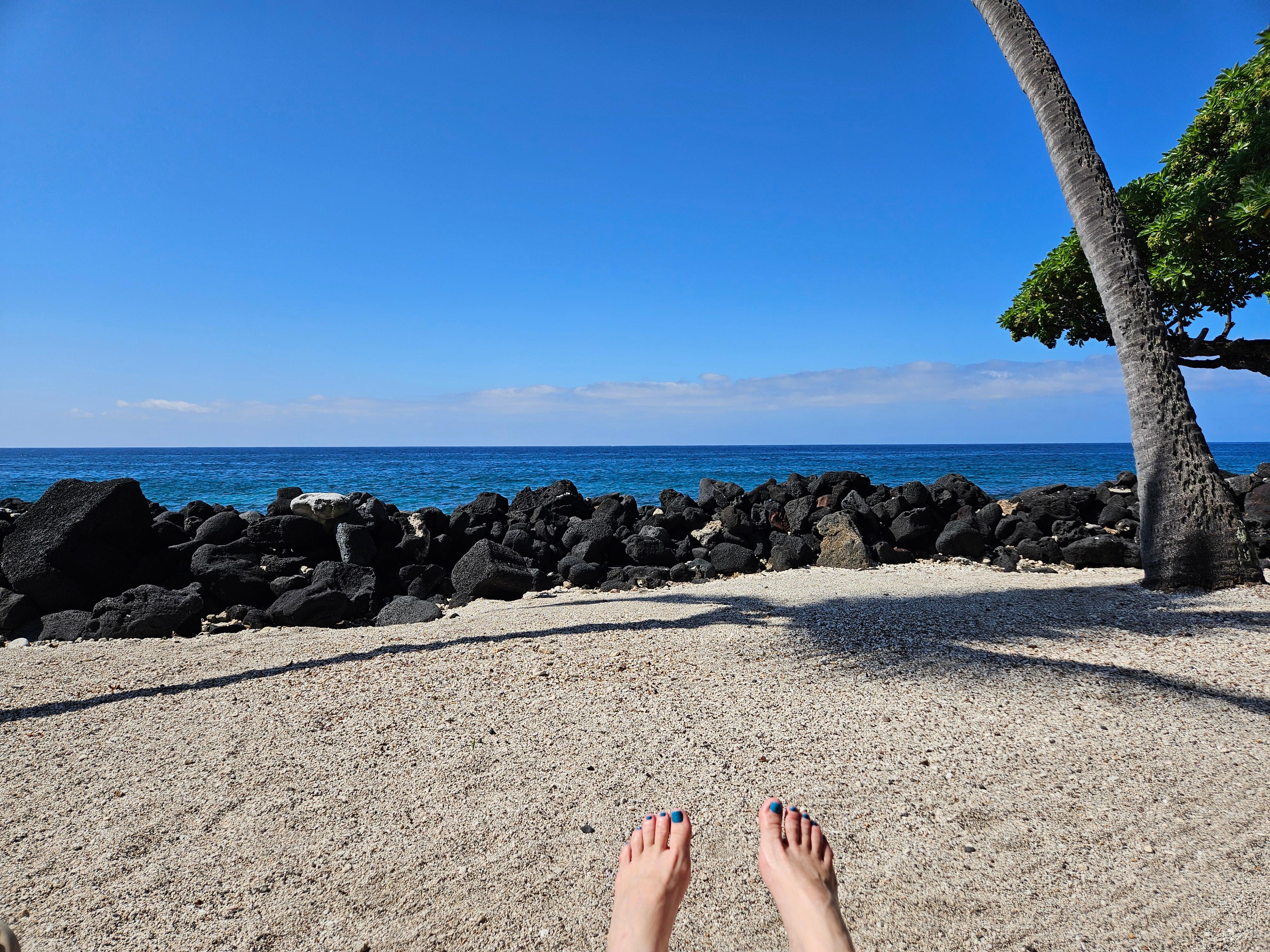Sitting at the beach area of the complex enjoying the views.