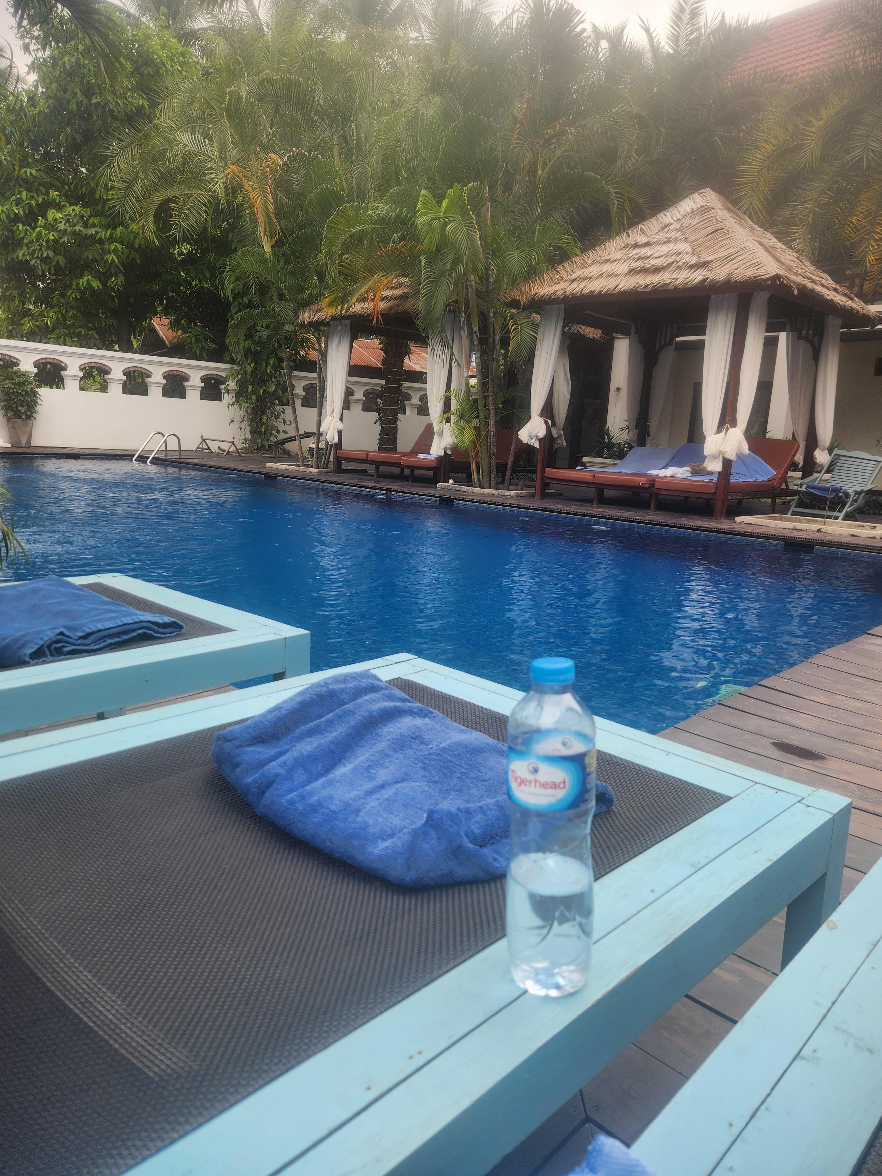 Great pool, cabanas and sun lounges, pool towels laid out on every chair.