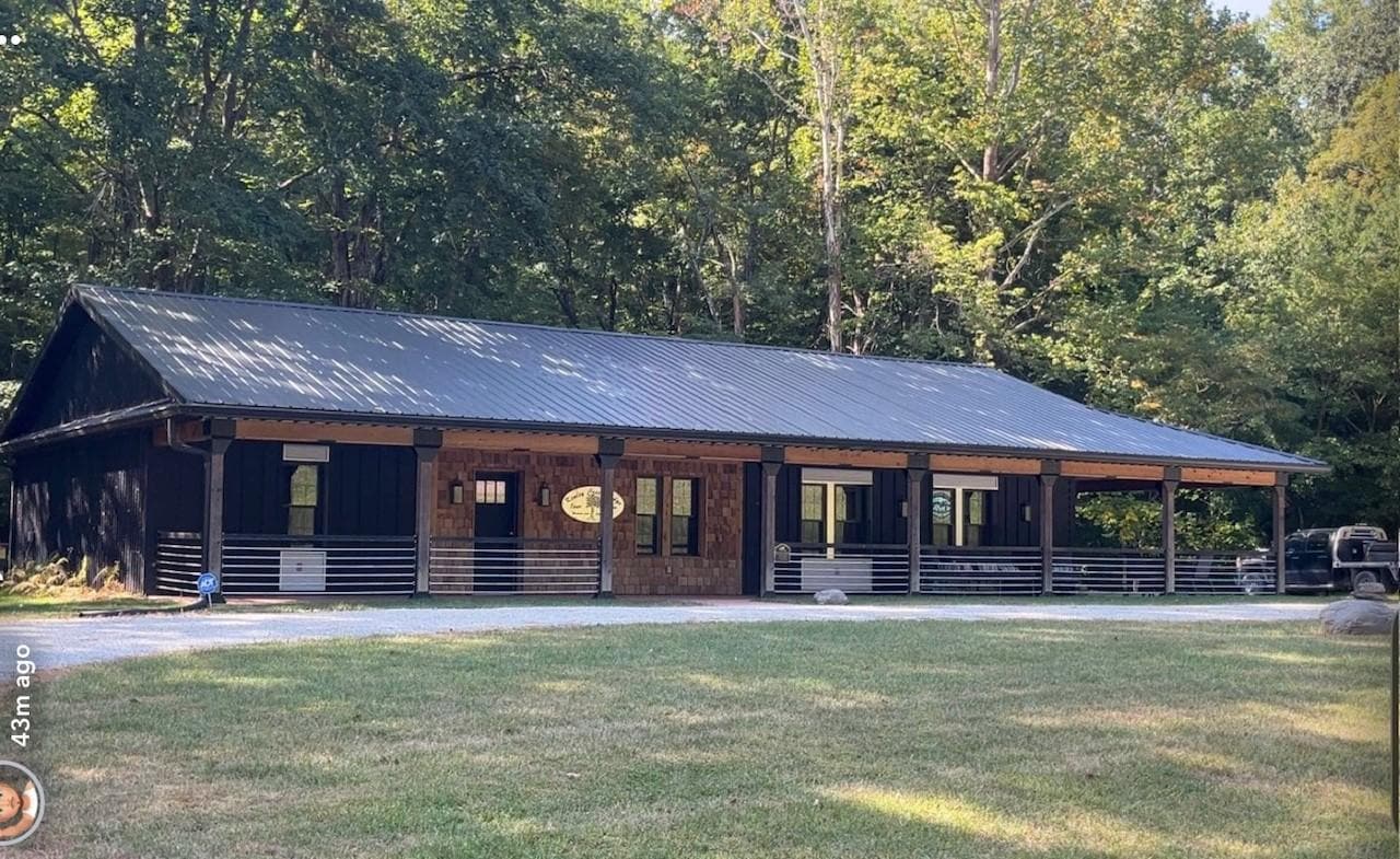 I just LOVED the way this lodge/home looked. The porches are so inviting!  