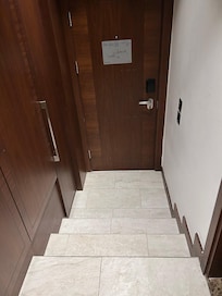 Steps on entering room