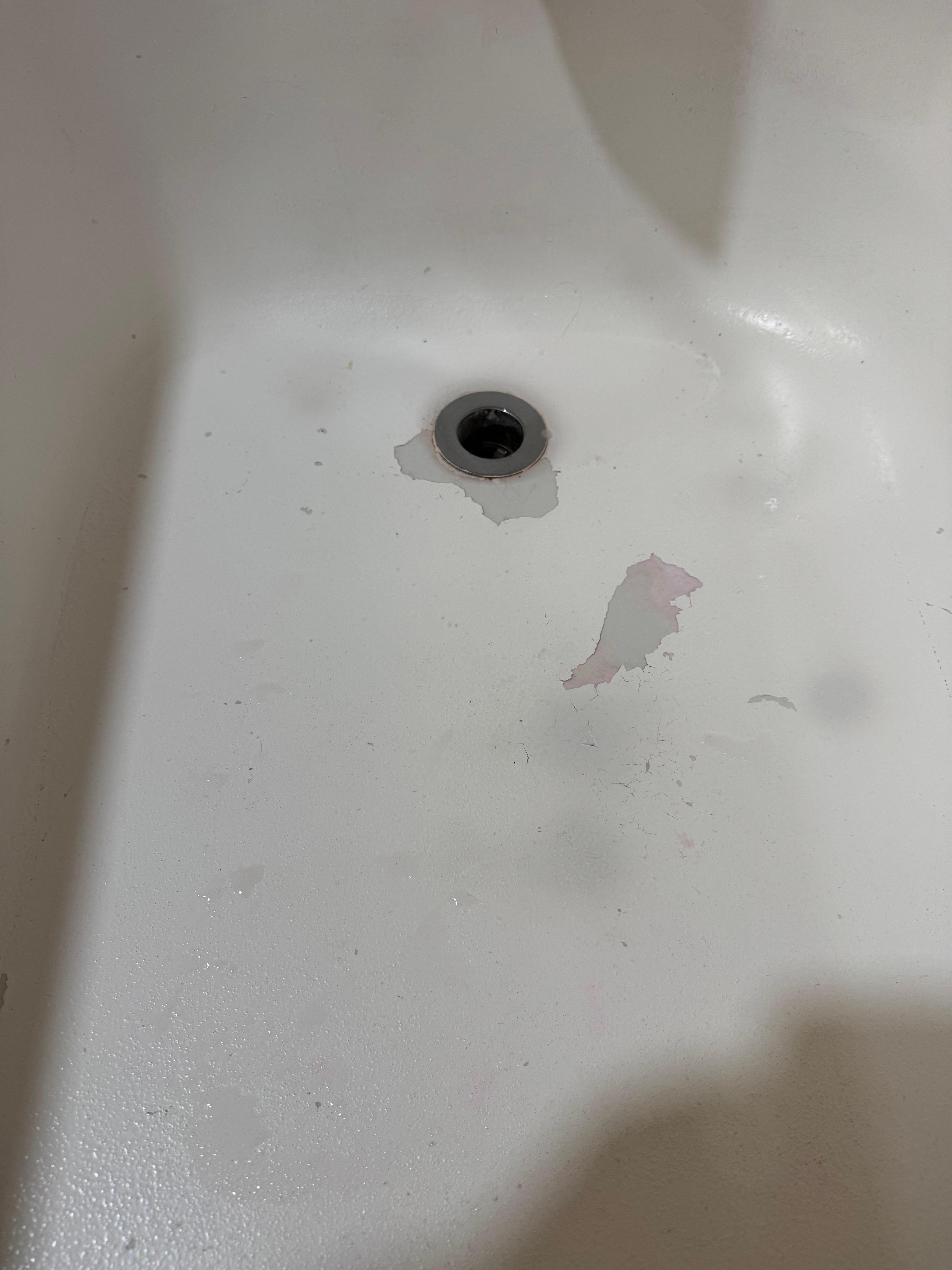 The finish in the tub is peeling away