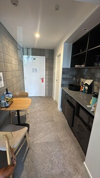 Entry way, kitchenette and table.