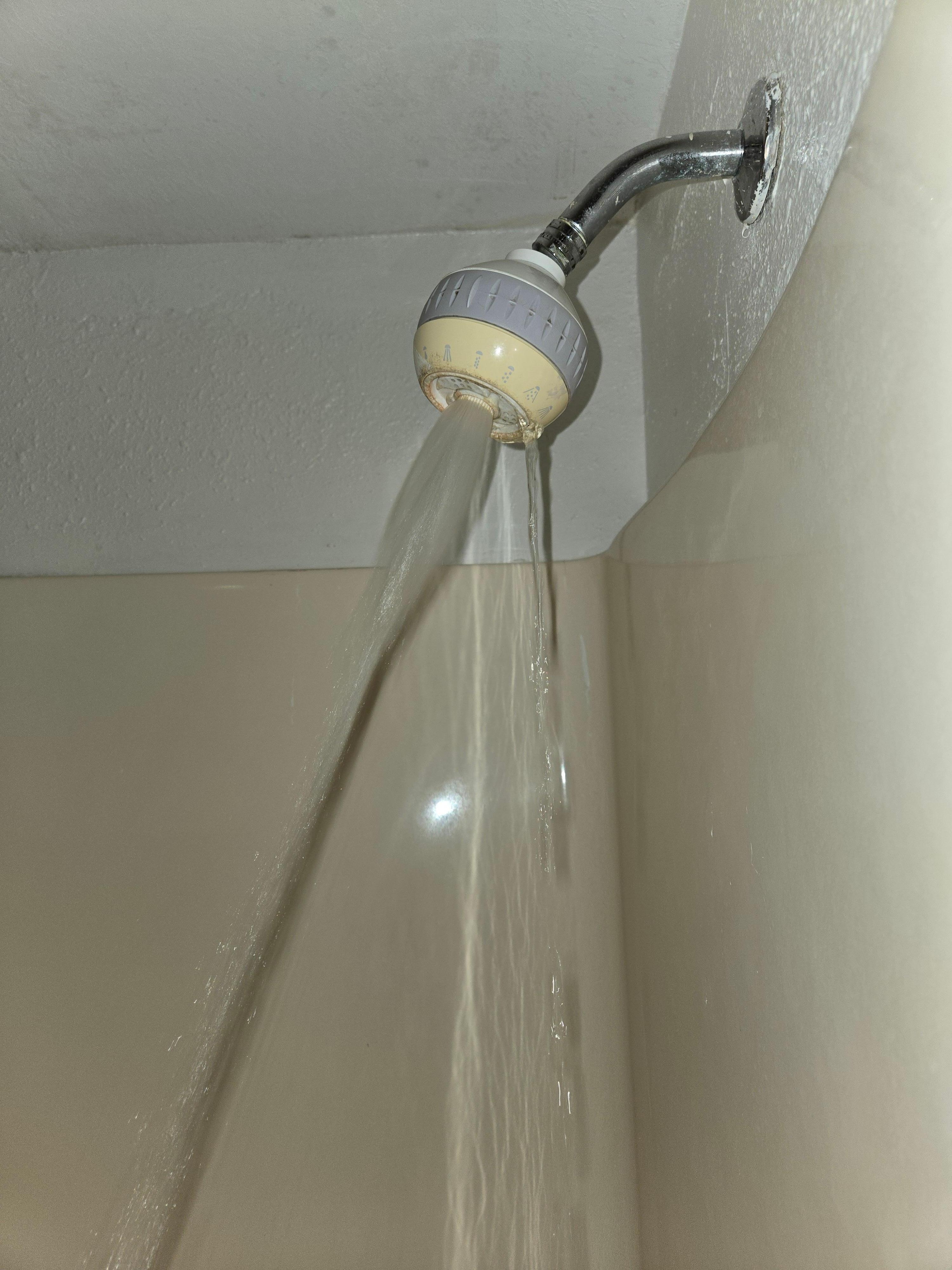 This is how the water came out of the shower head. Squirming water on the floor. Could not be adjusted at all.