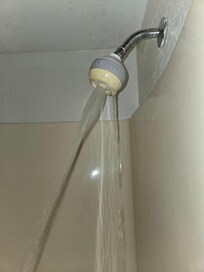 This is how the water came out of the shower head. Squirming water on the floor. Could not be adjusted at all.