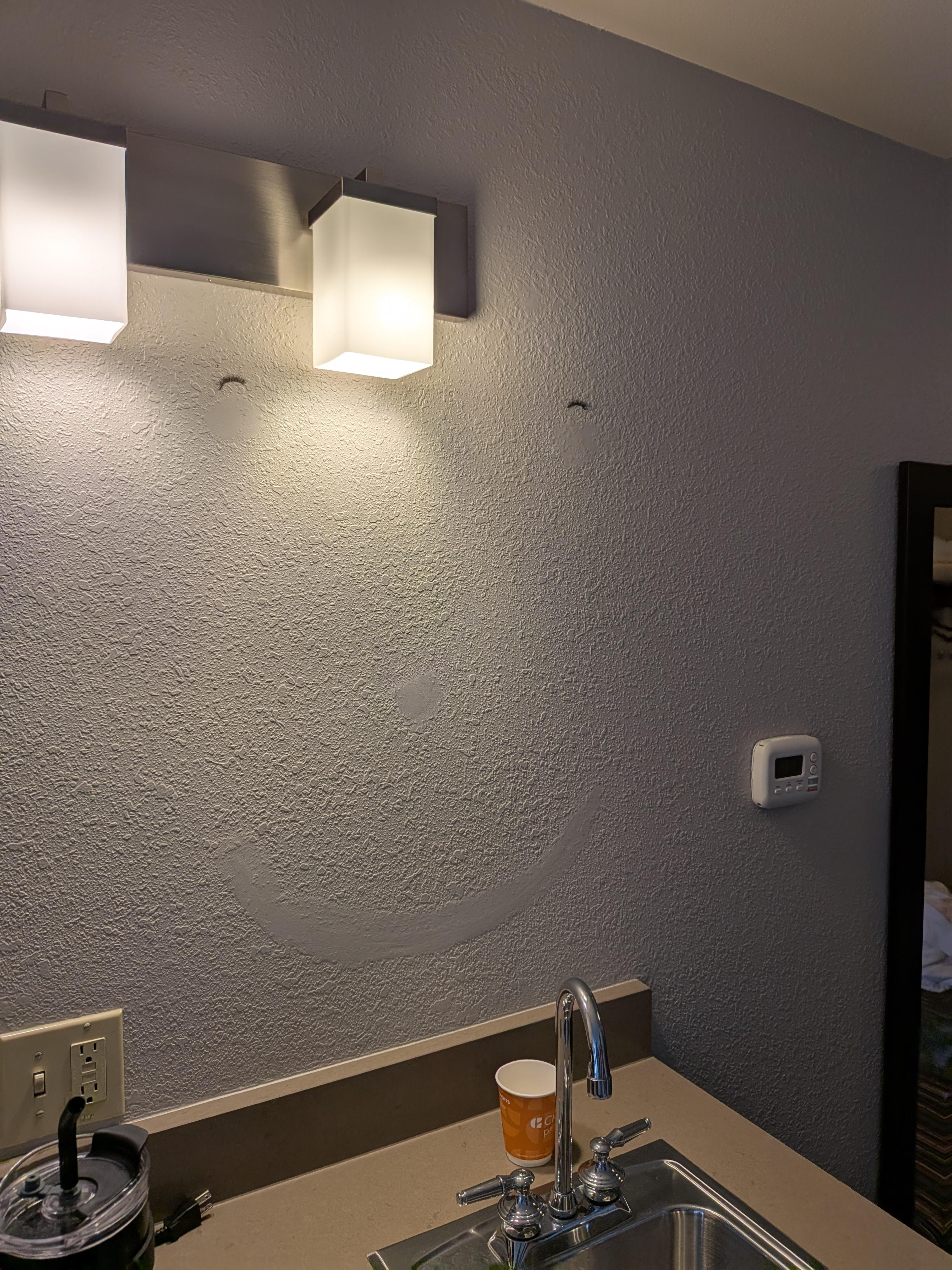 Odd smiley face on the wall with eyelashes. Other than that, it was clean. 