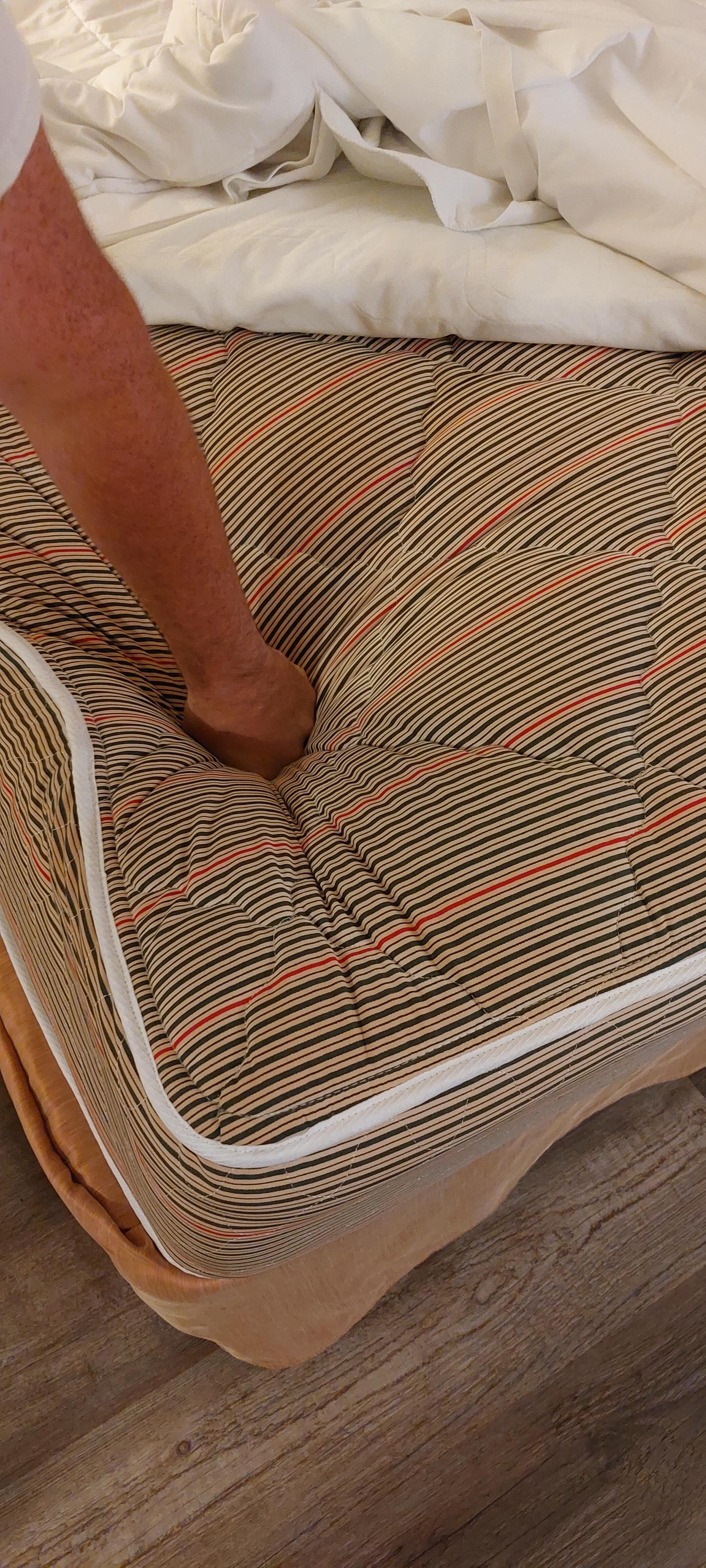 Bed older than us, incredibly uncomfortable. There were small stains on these sheets that could have been blood or feces.