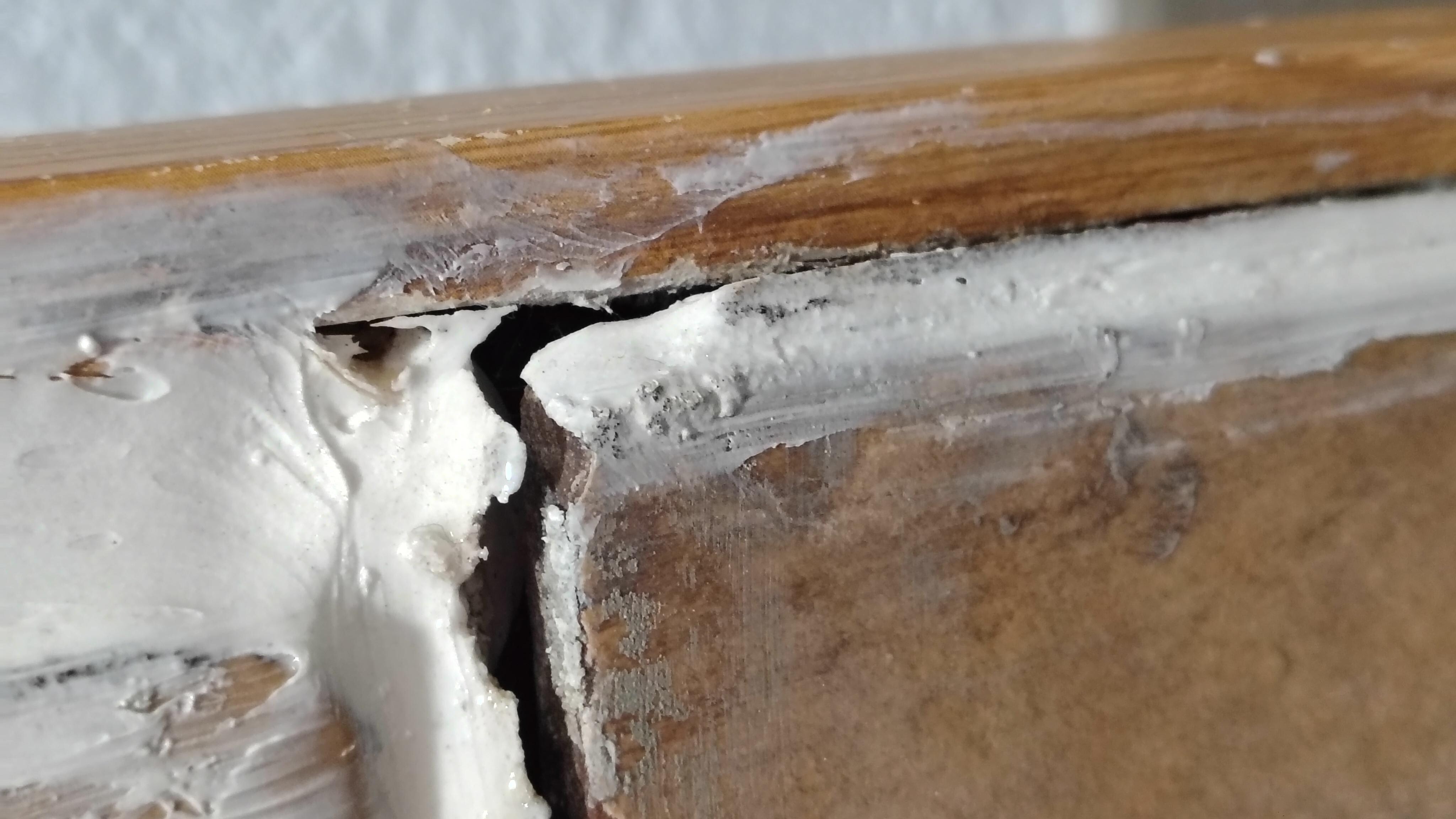 The show tile which is caulked not grouted and mold is under it and it is lifting and loose from the wall of the shower