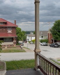 Front porch view. It was described on website as a beautiful view of the Mississippi river. In the bottom right corner, you can see a hole in the porch flooring.