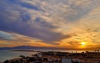 Sunset over the mountaind from the rooftop terrace