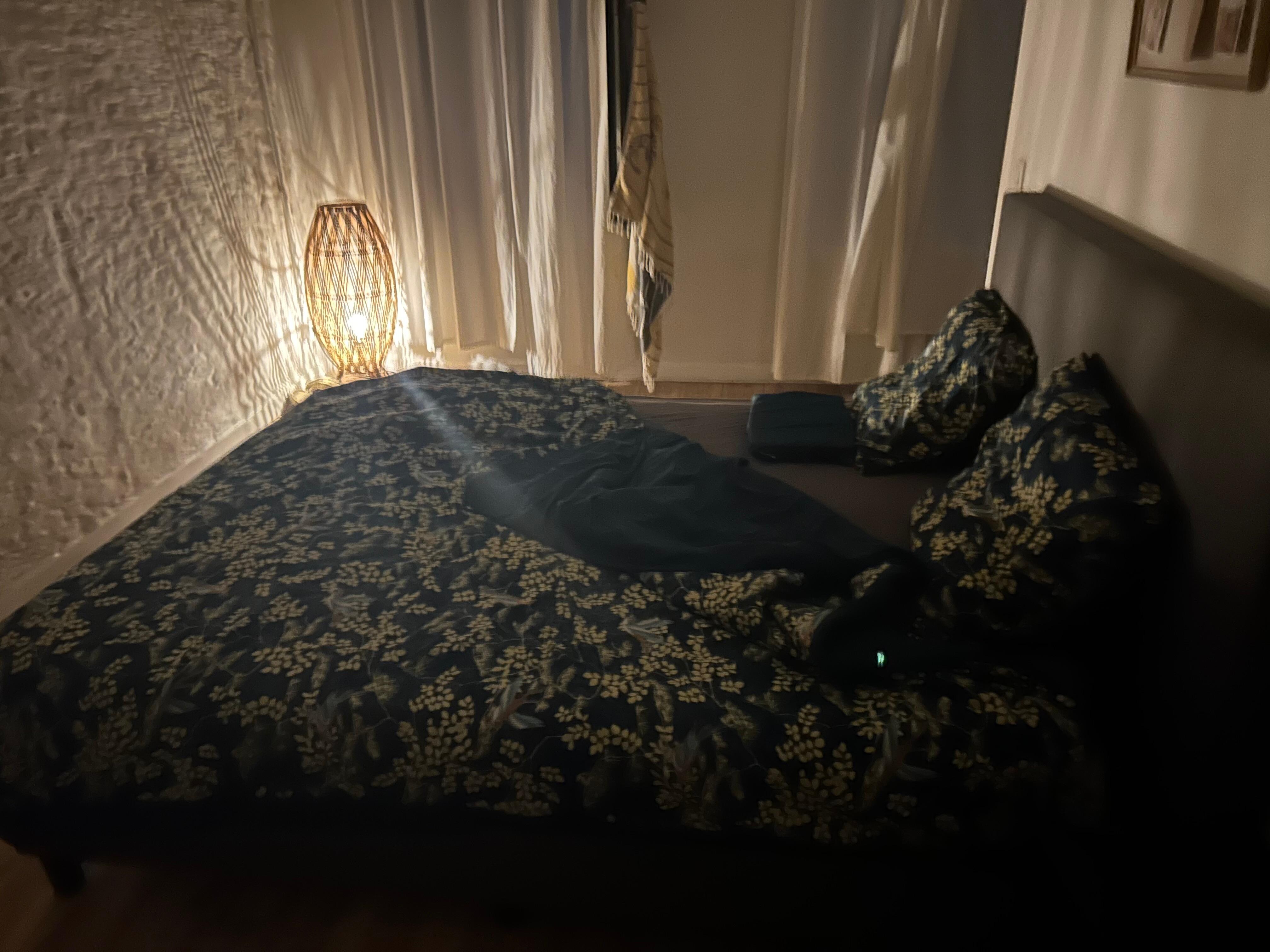 Tiny floor light is all that is provided in the bedroom