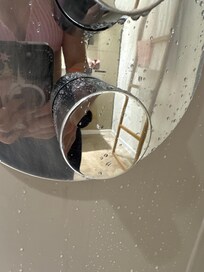 proof of shower knob turned to correct setting for hot water