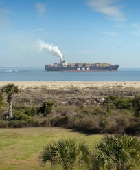 Watch cargo ships pass by so close that feels like you can just reach out and touch it.