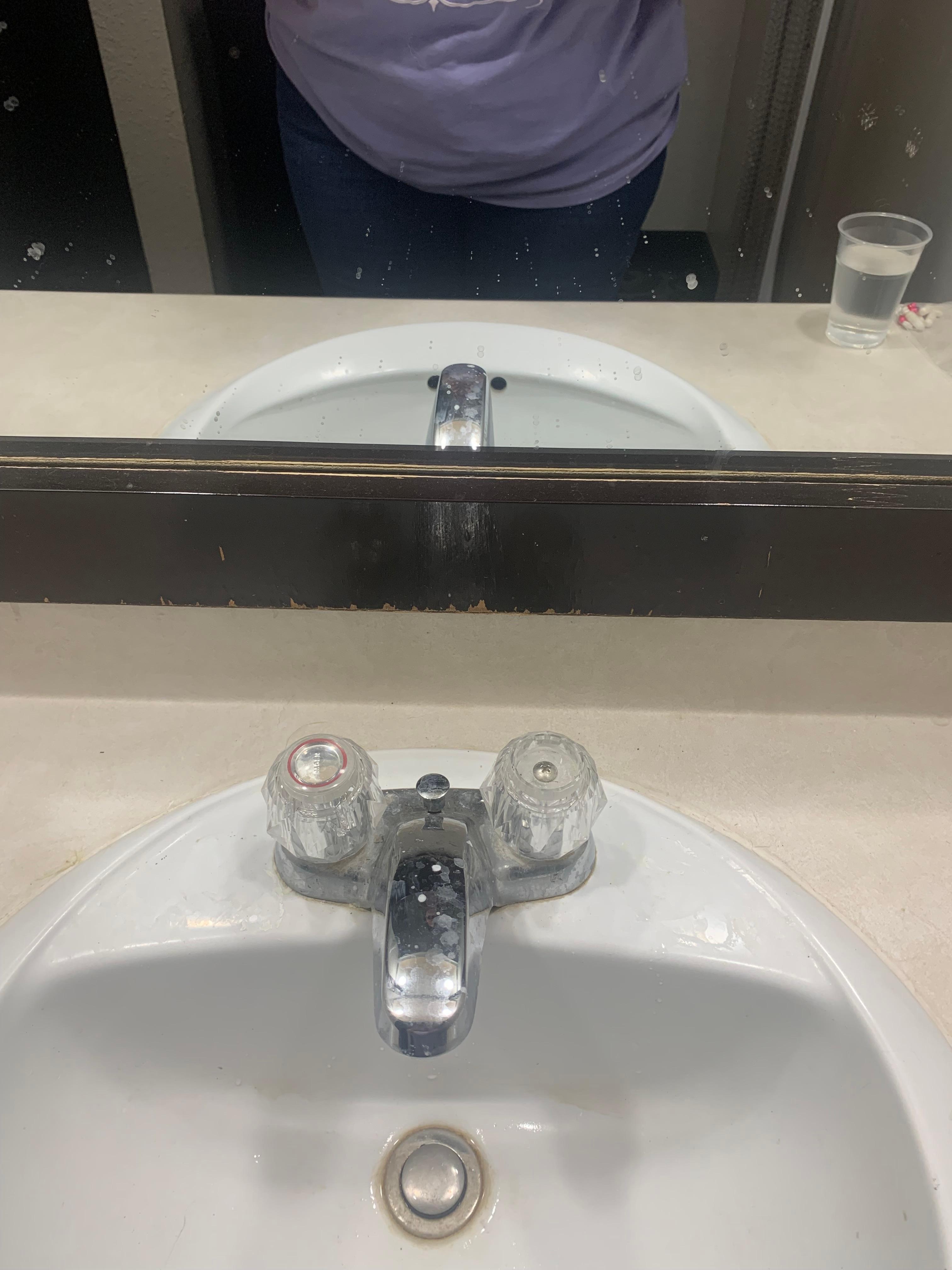 Dirty sink and mirror 