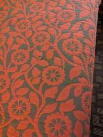 Blanket with cigarette burns