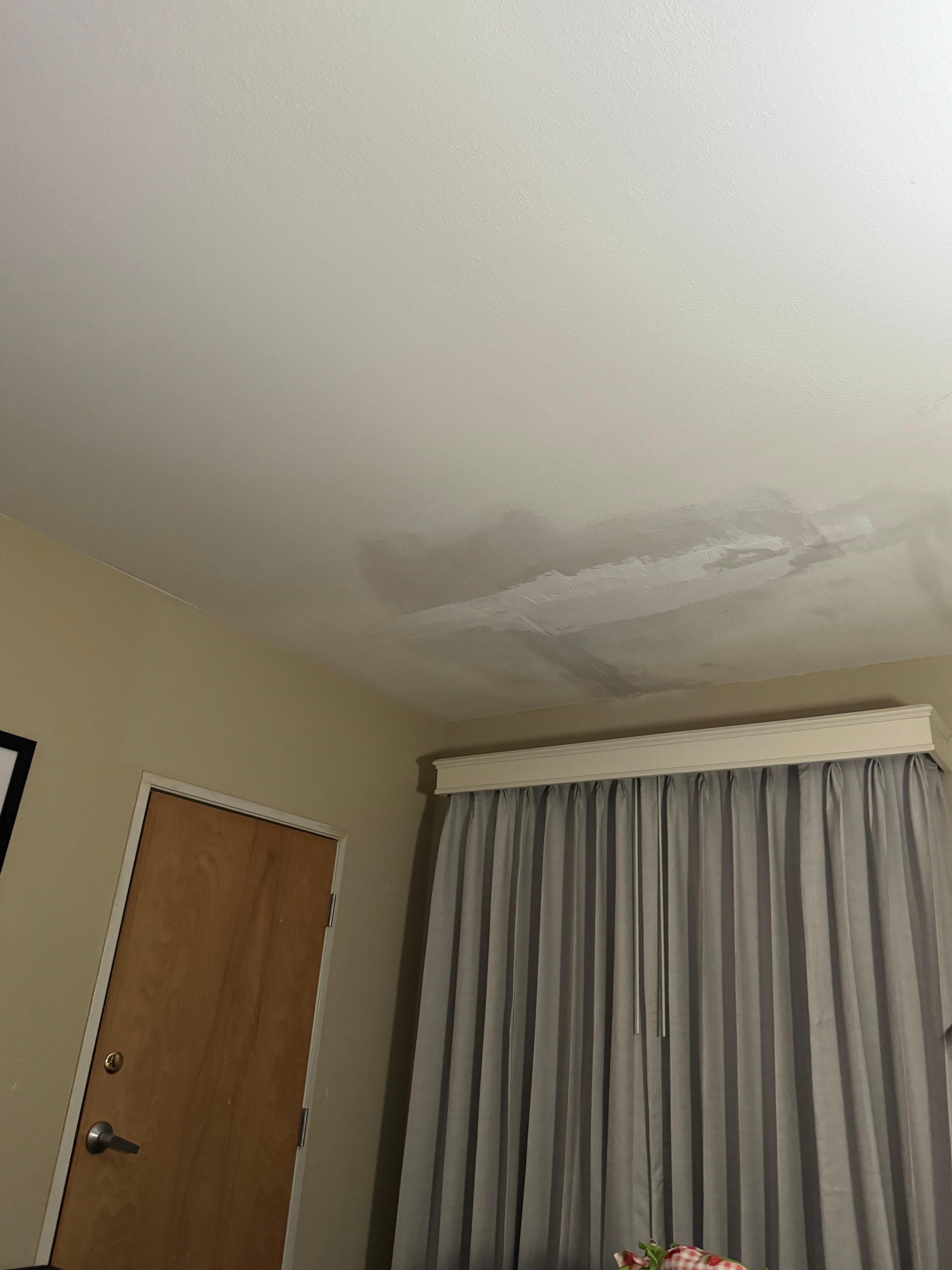 Ceiling in our room after rain. Very obvious wet marks and crack in their fix.