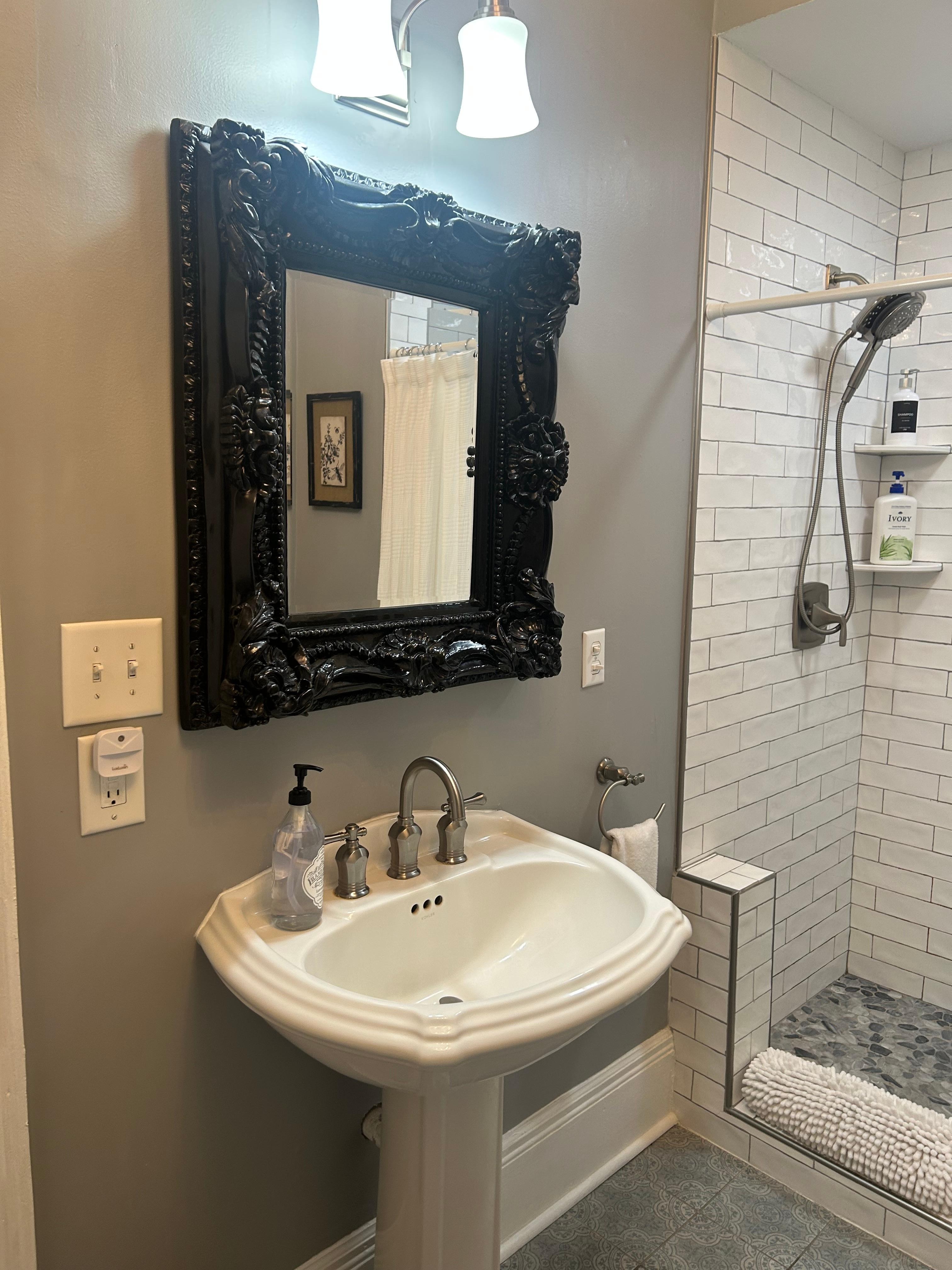 LOOOVVEEDD The mirror and the subway tile in the shower. The Rollie had a raised pattern to it and made it unique. Very clean bathroom  