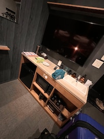 Room included hangers for clothes on a wall, room slippers, 2 bunk beds