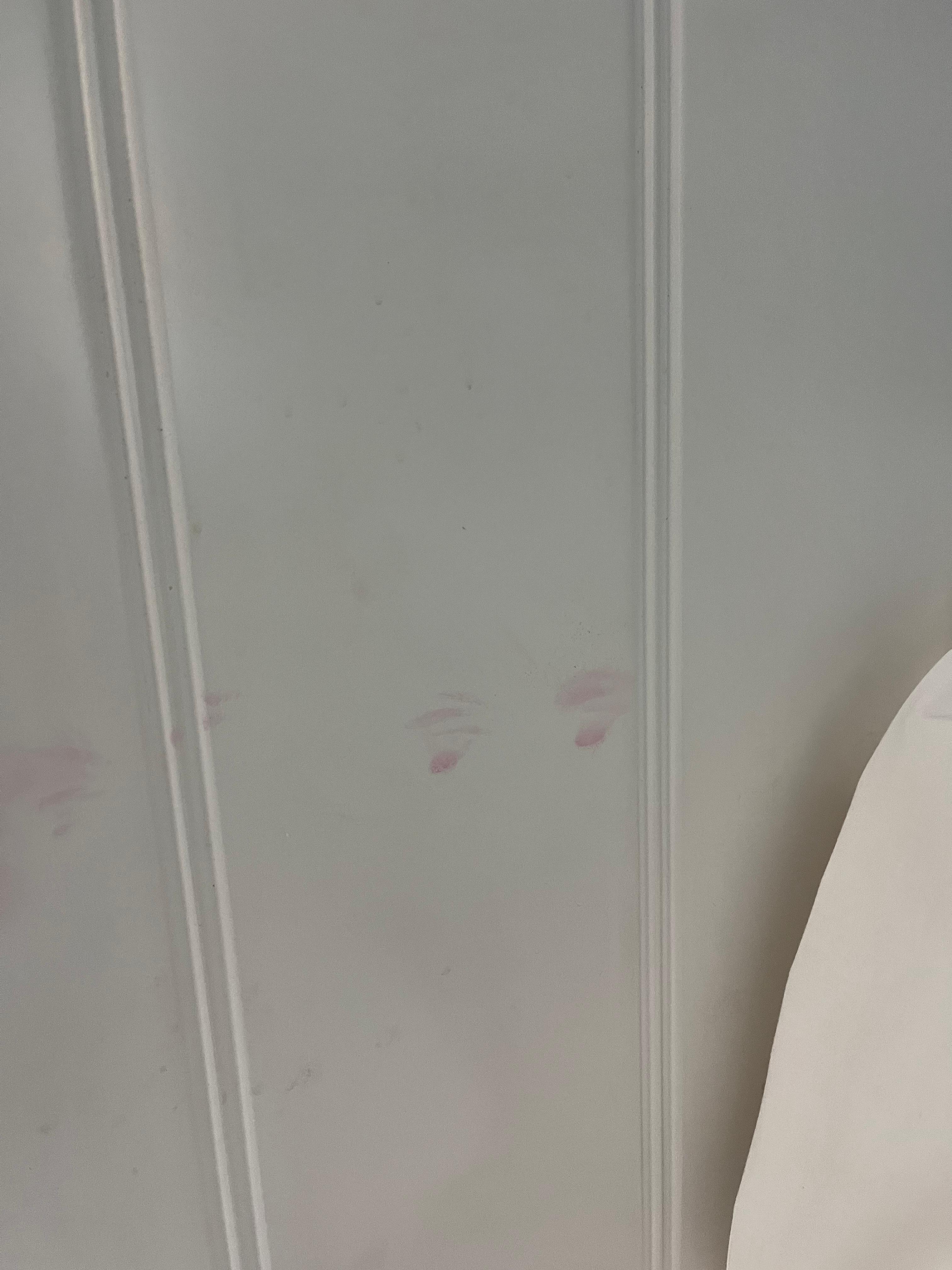 smeared lipstick kiss marks on headboard