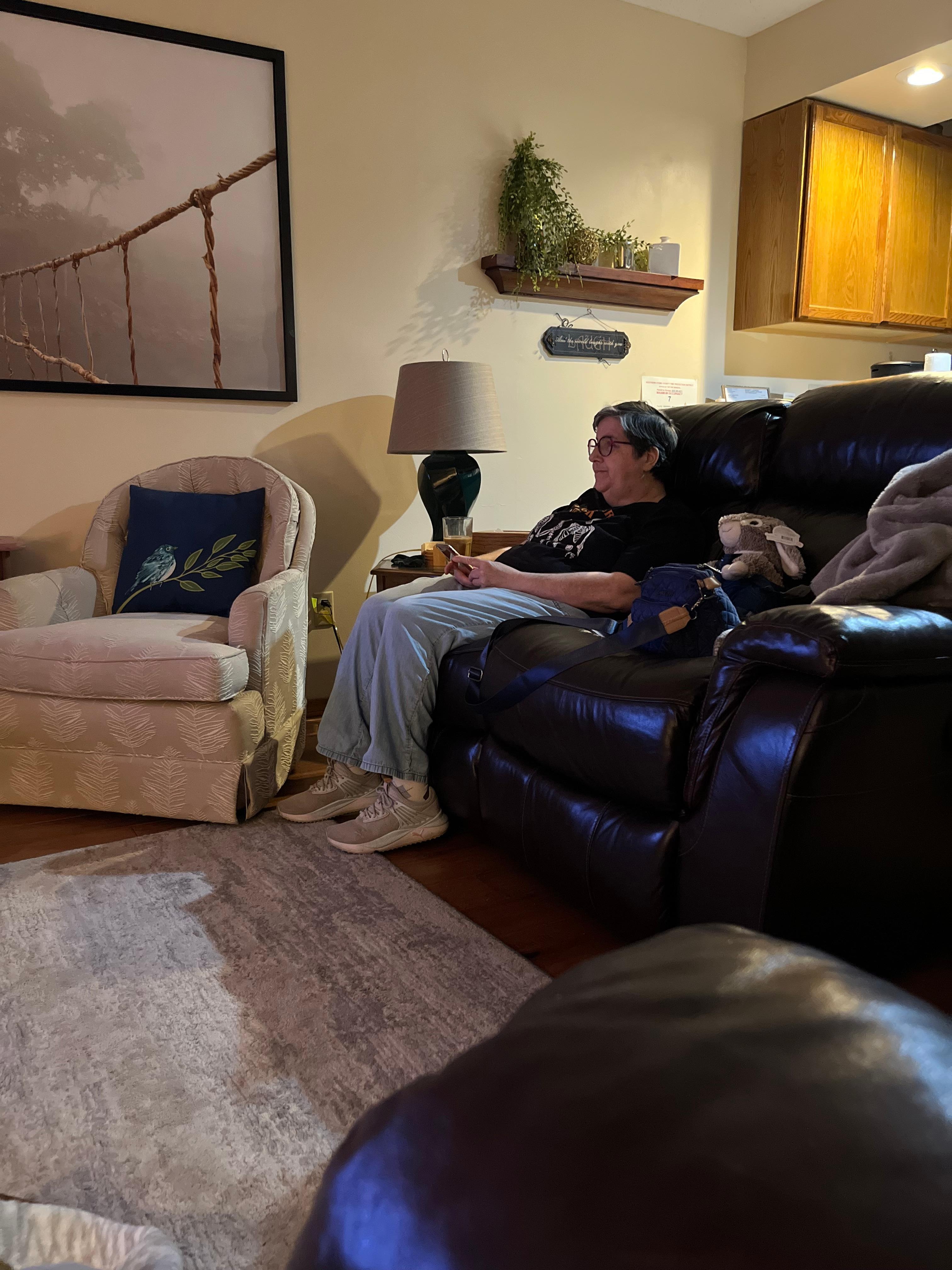 Showing the living area and recliners. She has two sets of these leather double recliners. Comfortable seating for 6