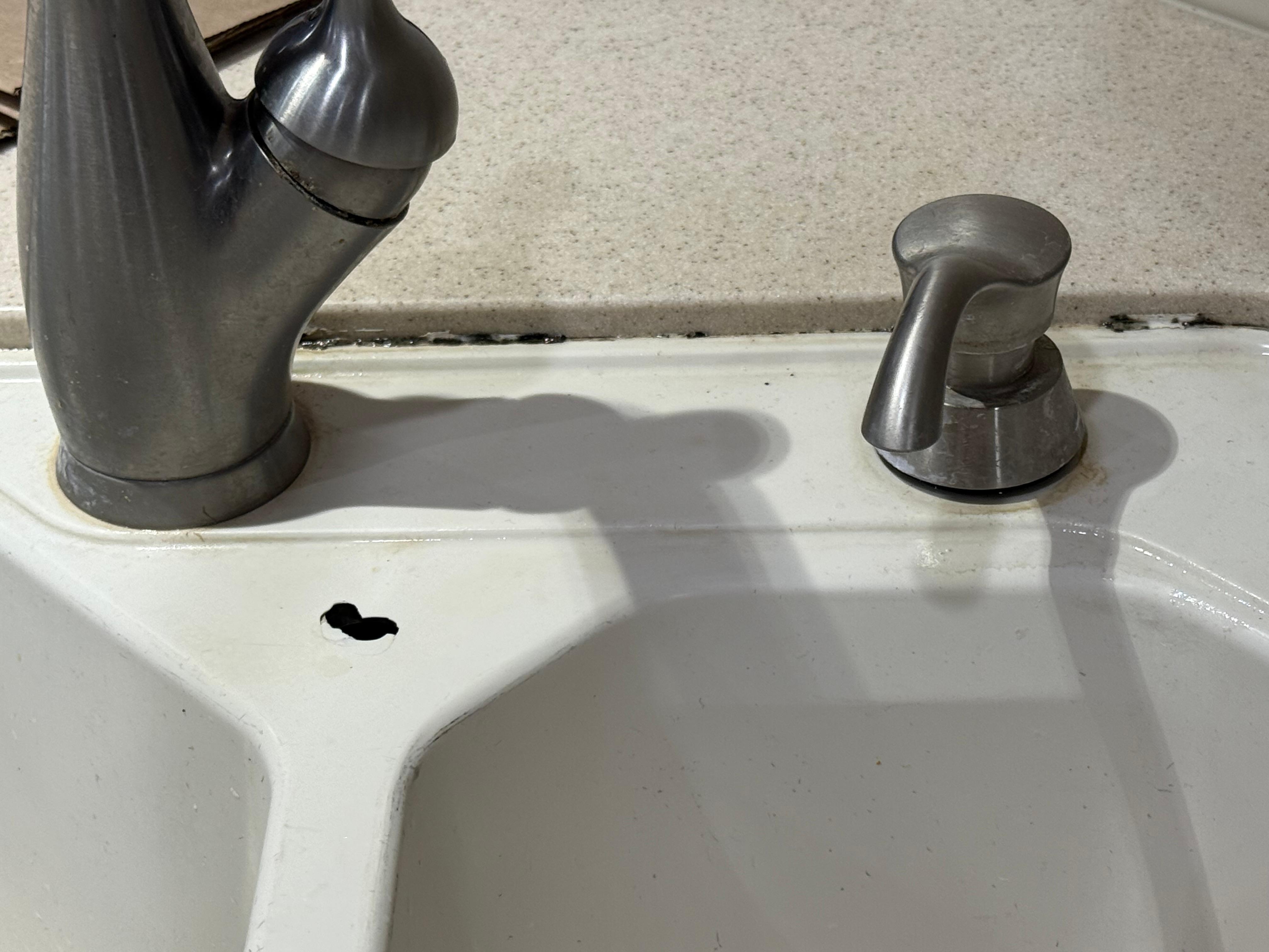 Kitchen sink with mold and holes 
