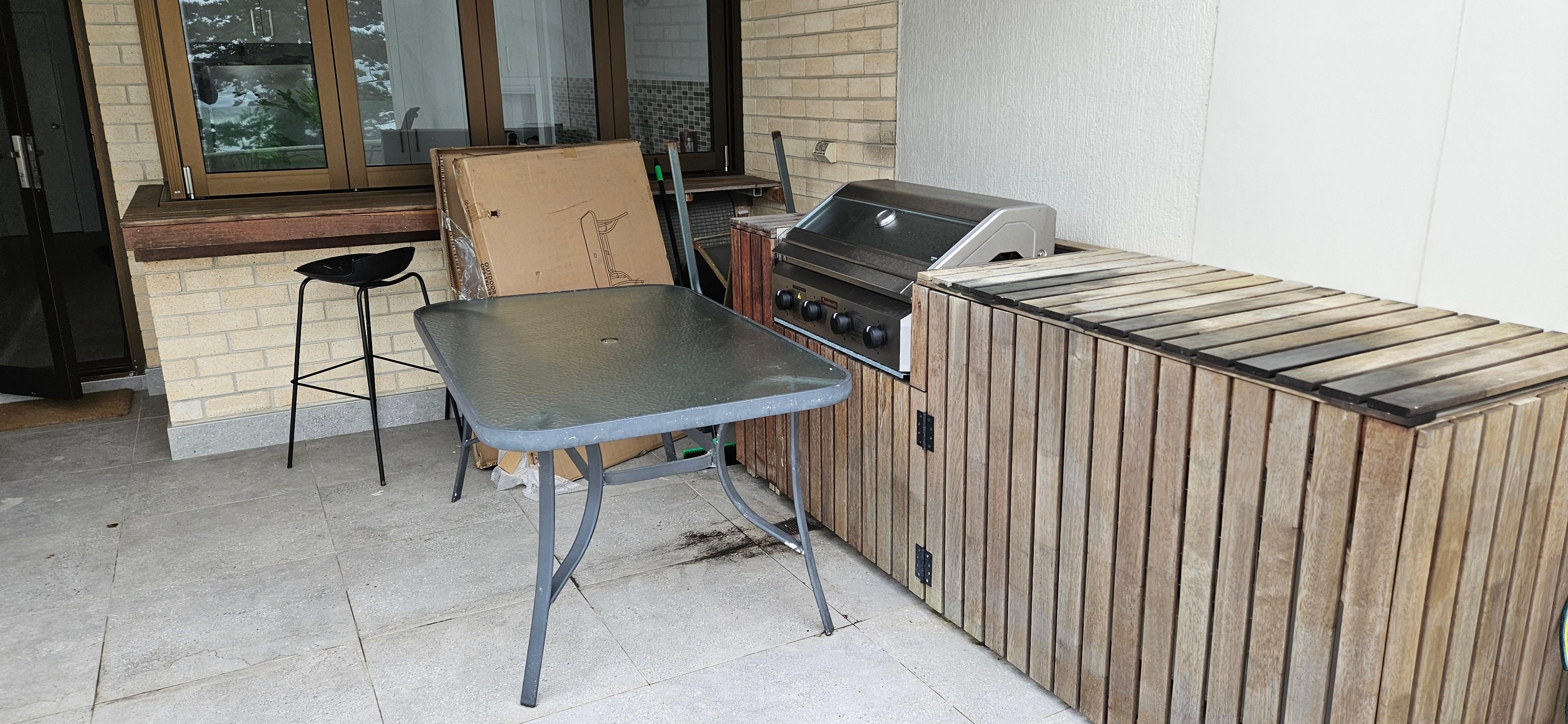 Broken stuff in front of bbq