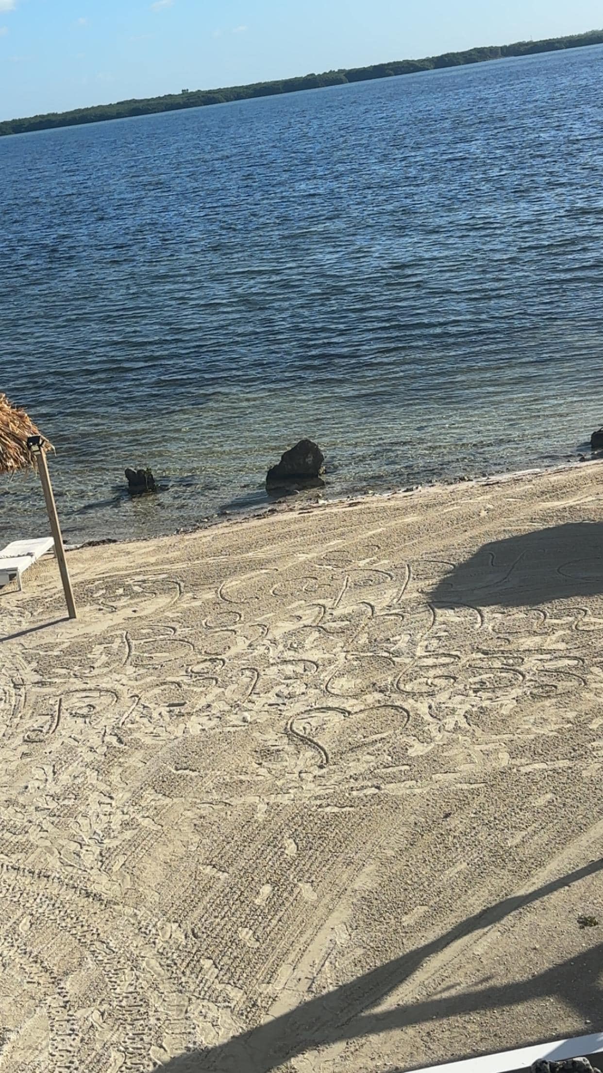 They wrote happy birthday for my wife on the sand 